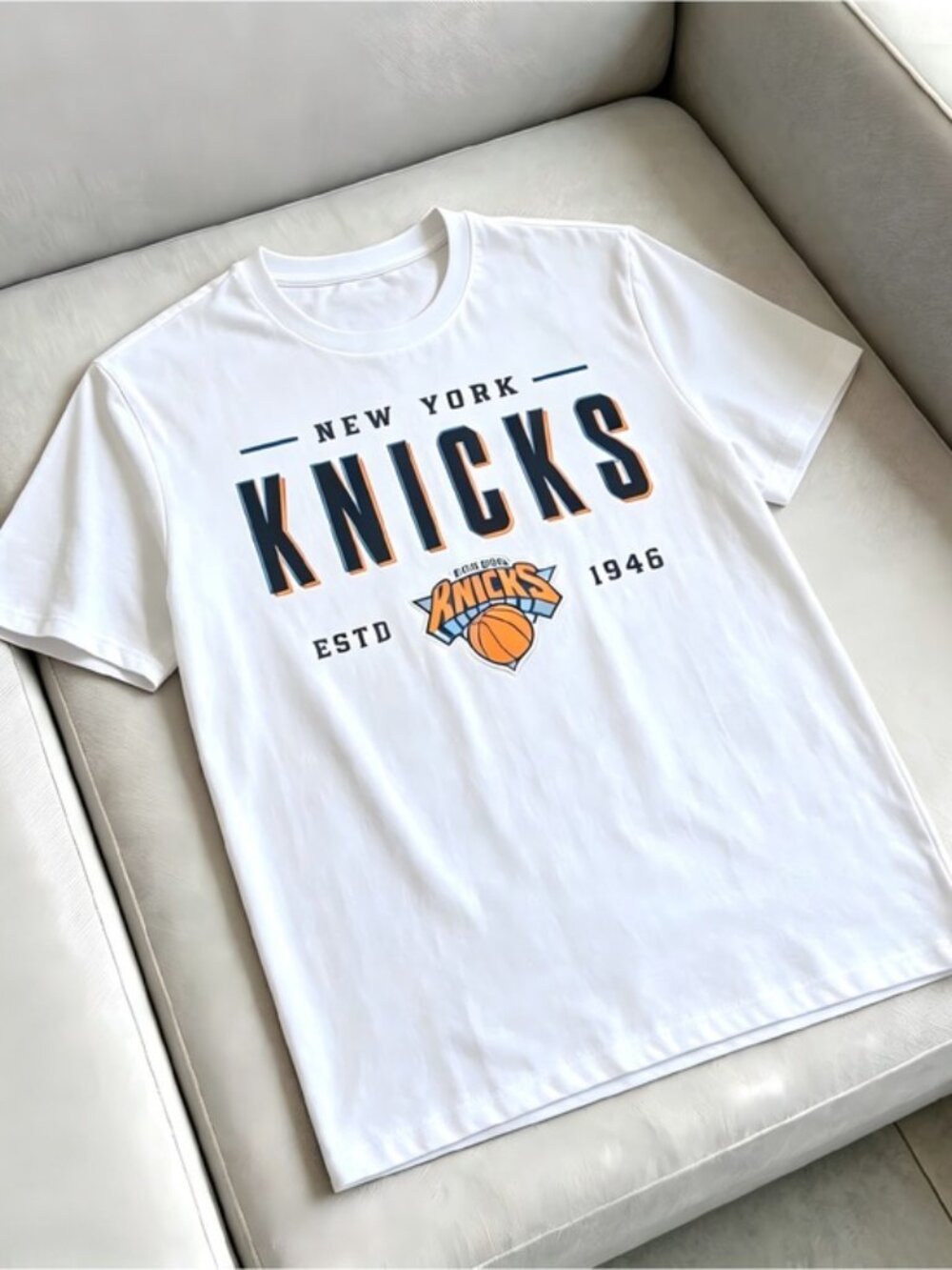 New York Knicks white with t-shirt with 'NEW YORK KNICKS' text and team logo
